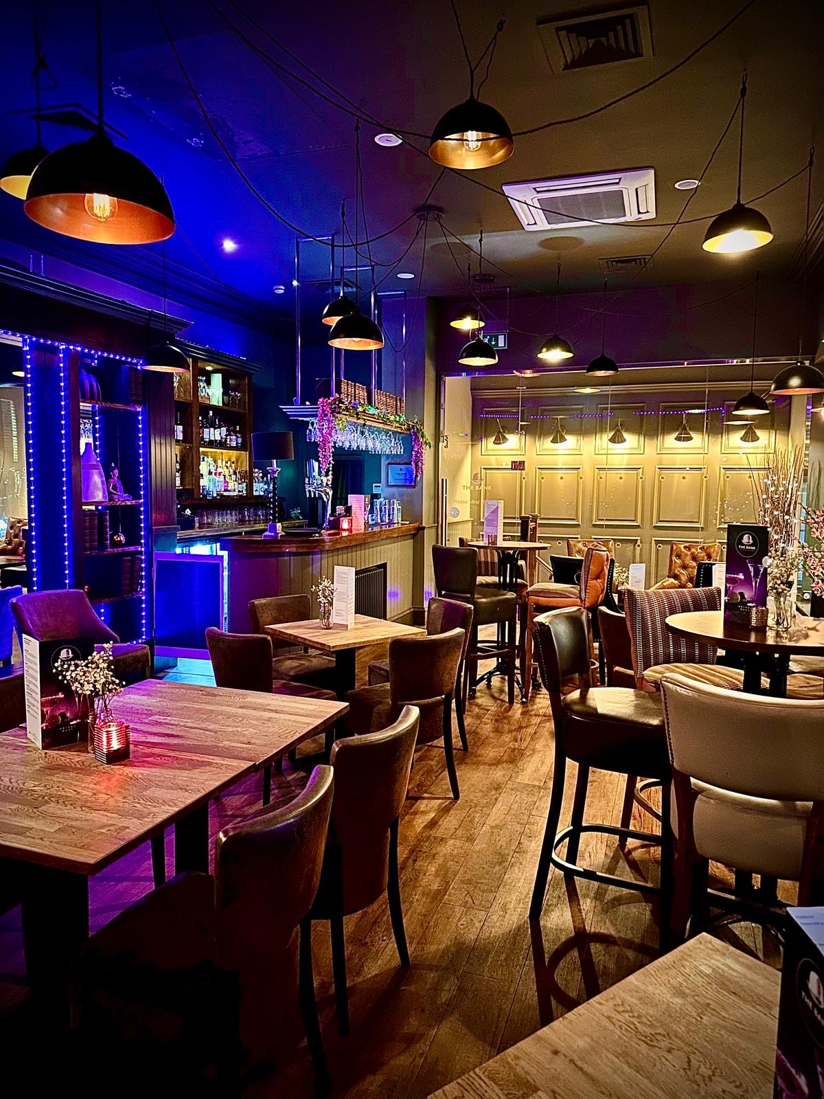 The Bank dining room with evening blue and purple lighting
